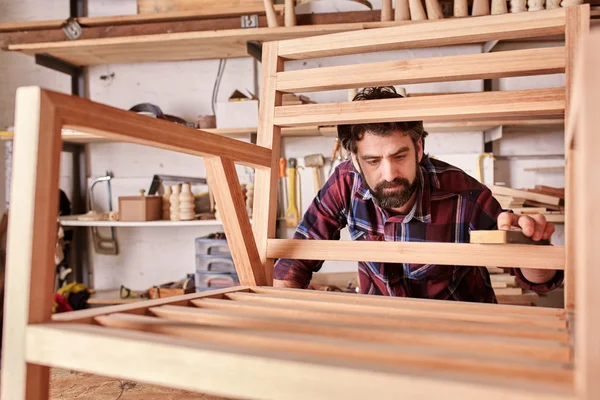 depositphotos_100909572-stock-photo-artisan-carefully-sanding-chair-frame
