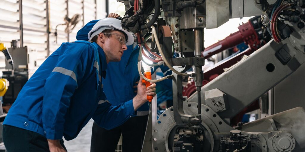 Engineer inspecting machinery as part of CE/UKCA compliance due diligence
