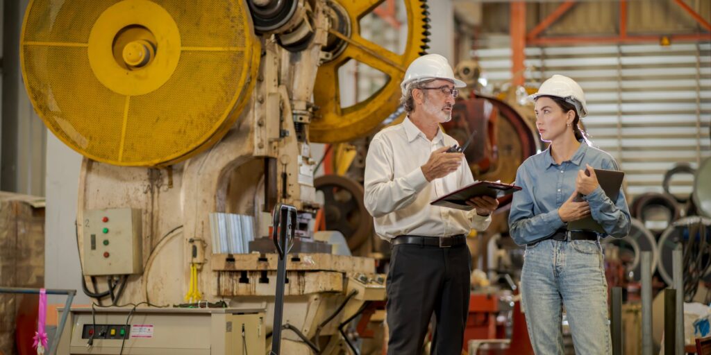 Engineers discussing CE markings under updated GB machinery safety regulations